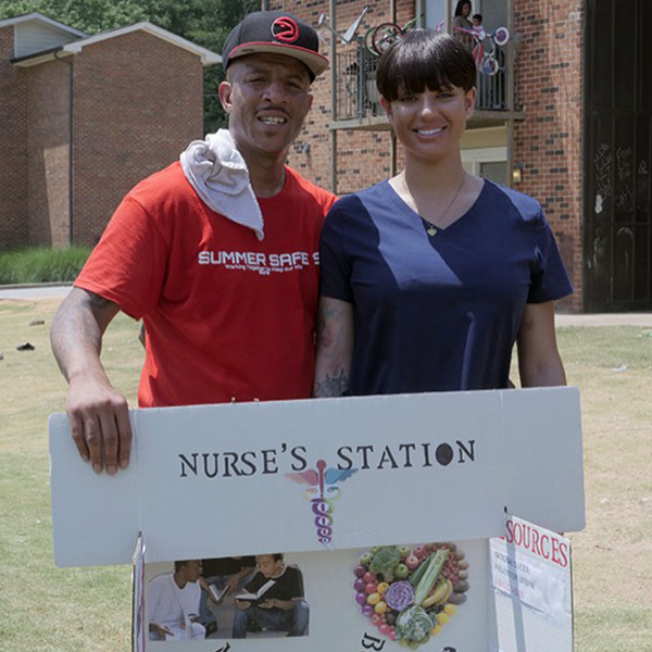 Summer Safe 19 - Holding Up Nurse's Station Sign